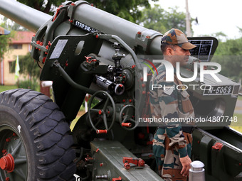 Indian school students take a close look at the various defence equipment during an exhibition organised by the Indian Army in Ajmer, Rajast...