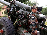 Indian school students take a close look at the various defence equipment during an exhibition organised by the Indian Army in Ajmer, Rajast...