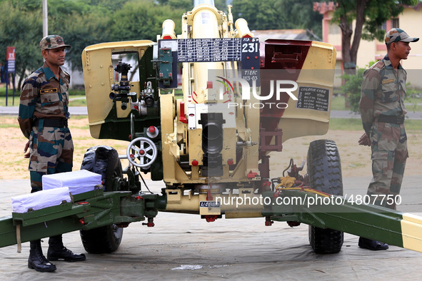 Indian school students take a close look at the various defence equipment during an exhibition organised by the Indian Army in Ajmer, Rajast...