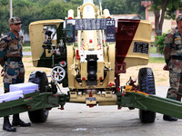 Indian school students take a close look at the various defence equipment during an exhibition organised by the Indian Army in Ajmer, Rajast...