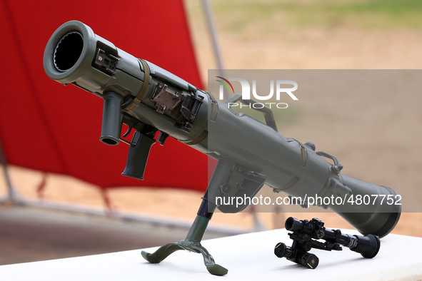 Indian school students take a close look at the various defence equipment during an exhibition organised by the Indian Army in Ajmer, Rajast...