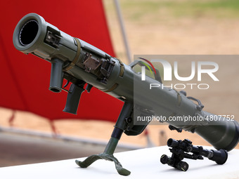 Indian school students take a close look at the various defence equipment during an exhibition organised by the Indian Army in Ajmer, Rajast...