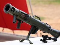 Indian school students take a close look at the various defence equipment during an exhibition organised by the Indian Army in Ajmer, Rajast...