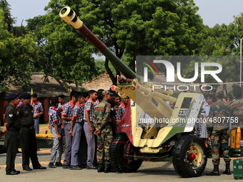 Indian school students take a close look at the various defence equipment during an exhibition organised by the Indian Army in Ajmer, Rajast...