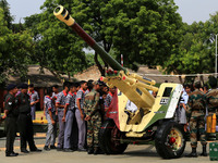 Indian school students take a close look at the various defence equipment during an exhibition organised by the Indian Army in Ajmer, Rajast...