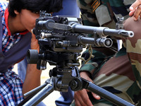 Indian school students take a close look at the various defence equipment during an exhibition organised by the Indian Army in Ajmer, Rajast...