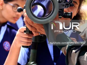 Indian school students take a close look at the various defence equipment during an exhibition organised by the Indian Army in Ajmer, Rajast...