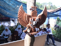 Cijeruk 1 Junior High School students openly study in the yard of a resident's house with a tarpaulin roof in Palasari Village, Bogor Regenc...