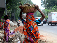 Bangladeshi women day laborer works in a road construction site in Dhaka, Bangladesh, on September 7, 2019. (