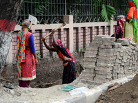 Bangladeshi women day laborer works in a road construction site in Dhaka, Bangladesh, on September 7, 2019. (