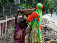 Bangladeshi women day laborer works in a road construction site in Dhaka, Bangladesh, on September 7, 2019. (