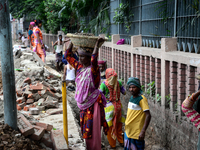 Bangladeshi men and women day laborer works in a road construction site in Dhaka, Bangladesh, on September 7, 2019. (