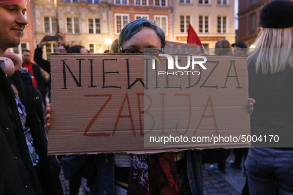 Protester holding sign that says 'Ignorance kills' during the rally against a bill that would criminalize sex education is seen in Gdansk, P...