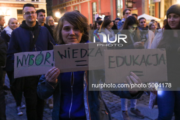 Protester holding sign that says ' choice = knowledge = education'  during the rally against a bill that would criminalize sex education is...