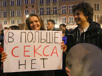 Protester holding sign that says in Russian 'In Poland there is no sex'  during the rally against a bill that would criminalize sex educatio...