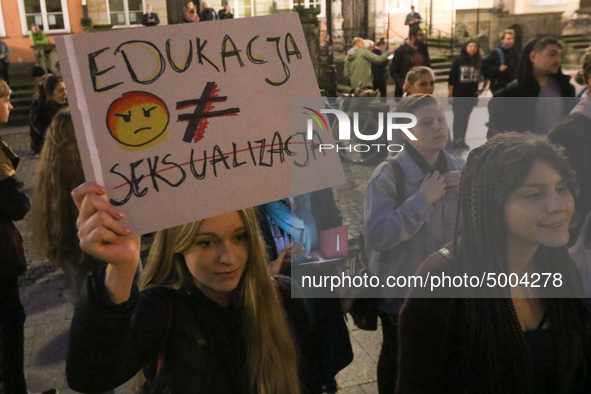 Protester holding sign that says 'education is not a sexualization' during the rally against a bill that would criminalize sex education is...