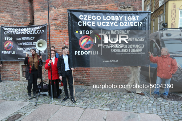 Protester holding sign that says 'Stop Pedophilia, What LGBT lobby wants to teach our children'  during the rally against a sexual education...