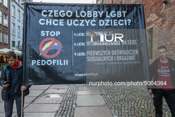 Protester holding sign that says 'Stop Pedophilia, What LGBT lobby wants to teach our children'  during the rally against a sexual education...