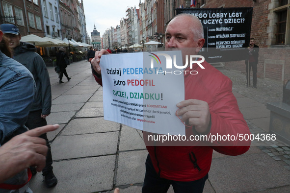 Protester holding sign that says 'Today homosexual - tomorrow pedophile, father, grandpa let's protect our children from sodomites '  during...