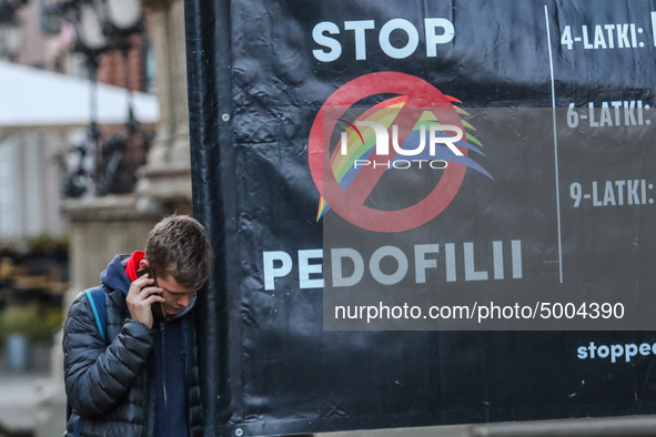 Protester holding sign that says 'Stop Pedophilia'  during the rally against a sexual education in Polish schools, supporting a bill that wo...