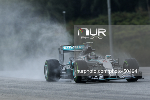 German Nico Rosberg of Mercedes AMG Petronas F1 Team drives on a wet track during the qualifying session of the Malaysian Formula One Grand...