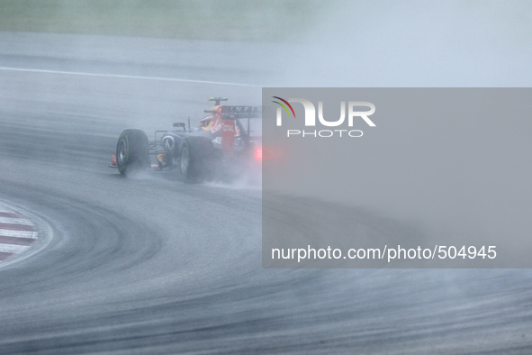 Russian Daniil Kvyat of Infiniti Red Bull Racing drives on a wet track during the qualifying session of the Malaysian Formula One Grand Prix...