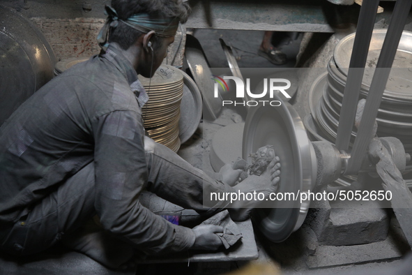 Bangladeshi Workers working in an aluminum pot-making small factory in Dhaka, Bangladesh, October 28, 2019. Aluminum Factory is very common...