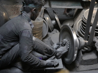 Bangladeshi Workers working in an aluminum pot-making small factory in Dhaka, Bangladesh, October 28, 2019. Aluminum Factory is very common...