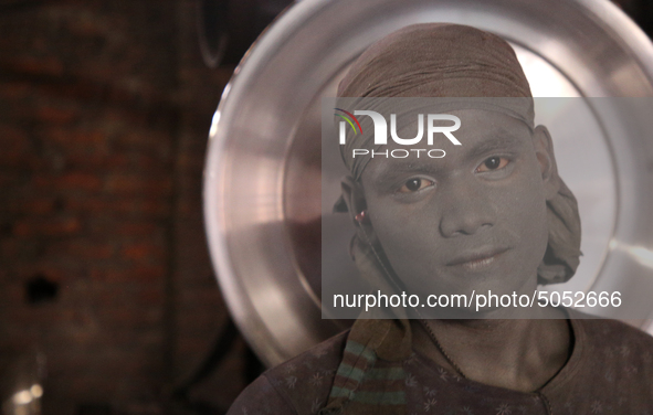 Bangladeshi Workers working in an aluminum pot-making small factory in Dhaka, Bangladesh, October 28, 2019. Aluminum Factory is very common...