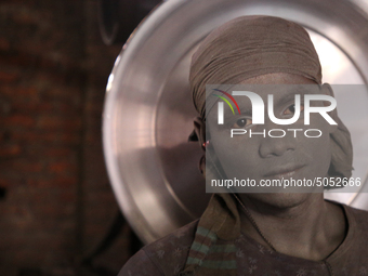 Bangladeshi Workers working in an aluminum pot-making small factory in Dhaka, Bangladesh, October 28, 2019. Aluminum Factory is very common...