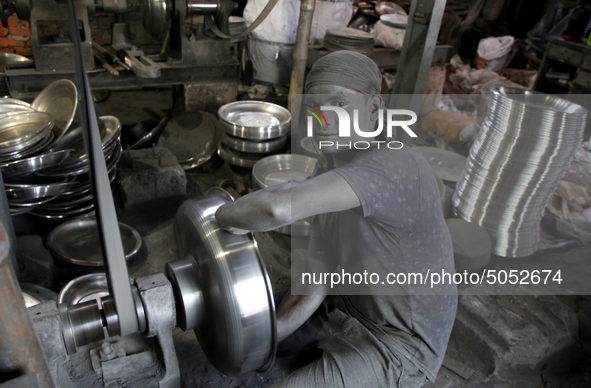 Bangladeshi Workers working in an aluminum pot-making small factory in Dhaka, Bangladesh, October 28, 2019. Aluminum Factory is very common...