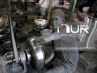 Bangladeshi Workers working in an aluminum pot-making small factory in Dhaka, Bangladesh, October 28, 2019. Aluminum Factory is very common...