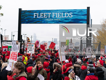 Thousands of striking teachers and supporters arrive for a rally at the Lincoln Yards development site in Chicago on October 29, 2019. The C...