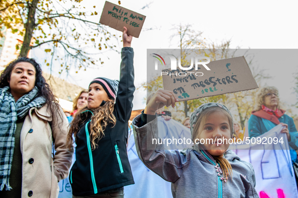 Some little girls are seen holding placards supporting their teacher mother during the massive teachers demonstration that took place in The...