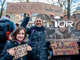 A woman and her daughters are seen holding placards, during the massive teachers demonstration that took place in The Hague, on November 6th...