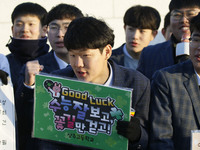 Nov 14, 2019 - Sangju, South Korea-A Group of High Schoolers cheer up for their senior group at entrance gate of Sangju high school in Sangj...