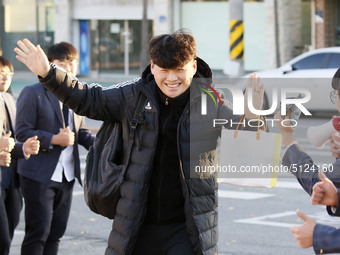 Nov 14, 2019 - Sangju, South Korea-A Group of High Schoolers cheer up for their senior group at entrance gate of Sangju high school in Sangj...