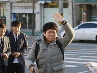 Nov 14, 2019 - Sangju, South Korea-A Group of High Schoolers cheer up for their senior group at entrance gate of Sangju high school in Sangj...