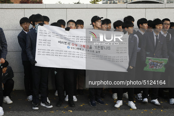 Nov 14, 2019 - Sangju, South Korea-A Group of High Schoolers cheer up for their senior group at entrance gate of Sangju high school in Sangj...