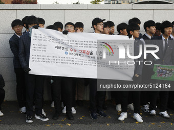 Nov 14, 2019 - Sangju, South Korea-A Group of High Schoolers cheer up for their senior group at entrance gate of Sangju high school in Sangj...