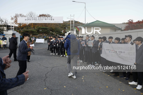 Nov 14, 2019 - Sangju, South Korea-A Group of High Schoolers cheer up for their senior group at entrance gate of Sangju high school in Sangj...