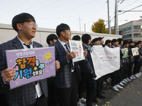 Nov 14, 2019 - Sangju, South Korea-A Group of High Schoolers cheer up for their senior group at entrance gate of Sangju high school in Sangj...