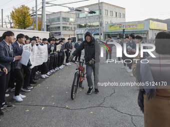 Nov 14, 2019 - Sangju, South Korea-A Group of High Schoolers cheer up for their senior group at entrance gate of Sangju high school in Sangj...