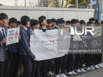 Nov 14, 2019 - Sangju, South Korea-A Group of High Schoolers cheer up for their senior group at entrance gate of Sangju high school in Sangj...