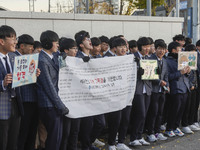 Nov 14, 2019 - Sangju, South Korea-A Group of High Schoolers cheer up for their senior group at entrance gate of Sangju high school in Sangj...