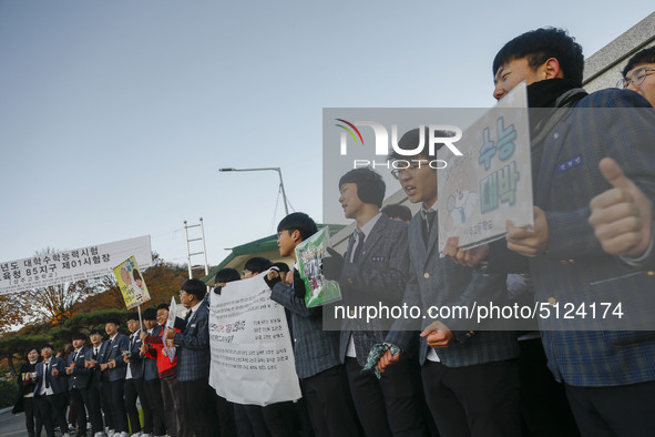 Nov 14, 2019 - Sangju, South Korea-A Group of High Schoolers cheer up for their senior group at entrance gate of Sangju high school in Sangj...