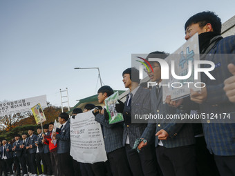 Nov 14, 2019 - Sangju, South Korea-A Group of High Schoolers cheer up for their senior group at entrance gate of Sangju high school in Sangj...