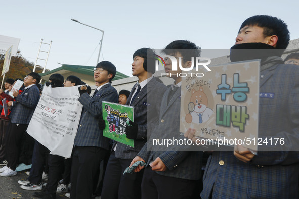 Nov 14, 2019 - Sangju, South Korea-A Group of High Schoolers cheer up for their senior group at entrance gate of Sangju high school in Sangj...