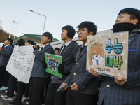 Nov 14, 2019 - Sangju, South Korea-A Group of High Schoolers cheer up for their senior group at entrance gate of Sangju high school in Sangj...