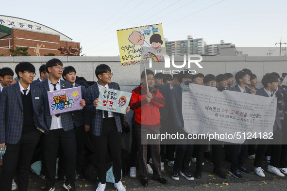 Nov 14, 2019 - Sangju, South Korea-A Group of High Schoolers cheer up for their senior group at entrance gate of Sangju high school in Sangj...